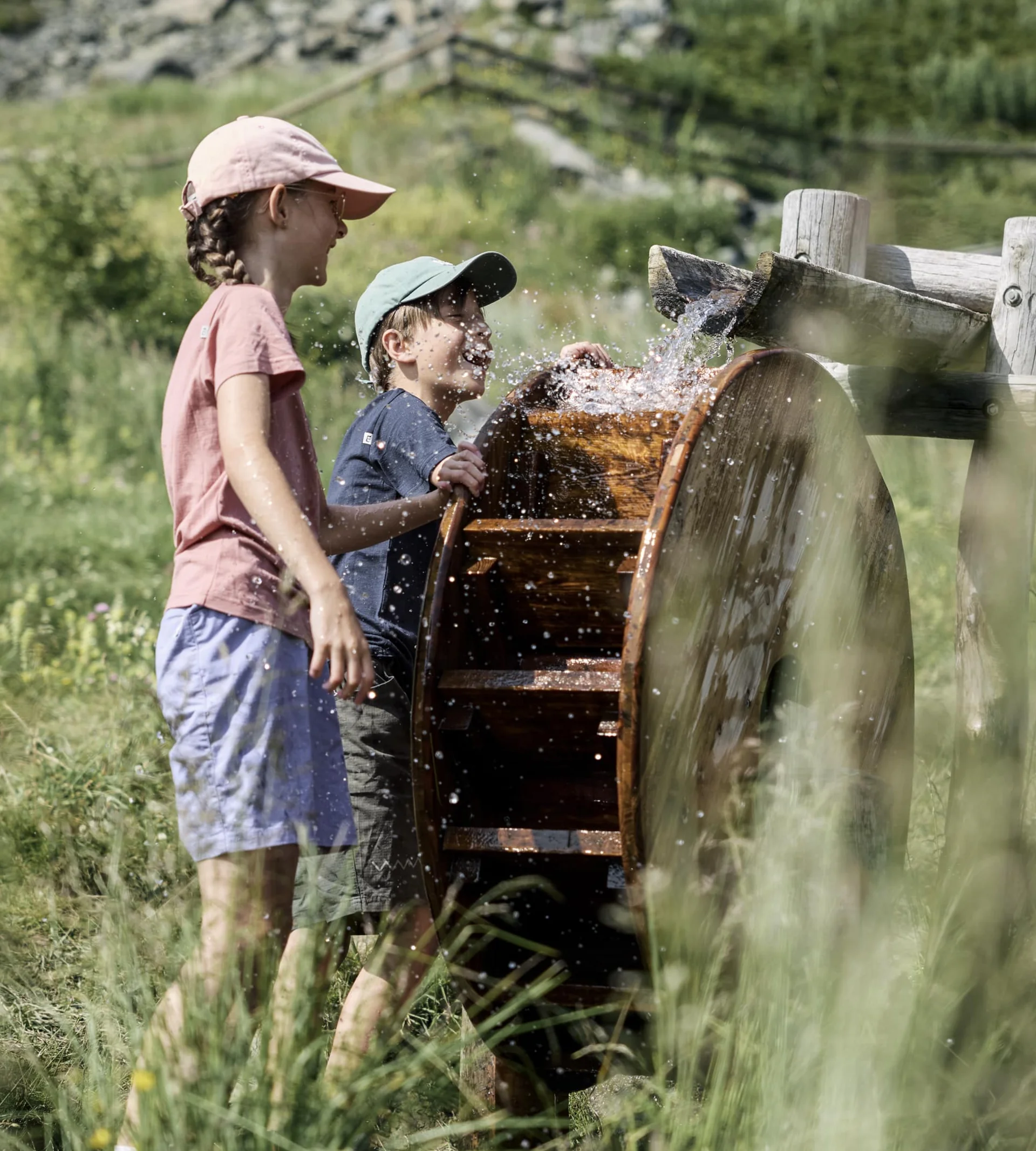 Why Choose La Ginabelle Children play at a water playground in the summer.