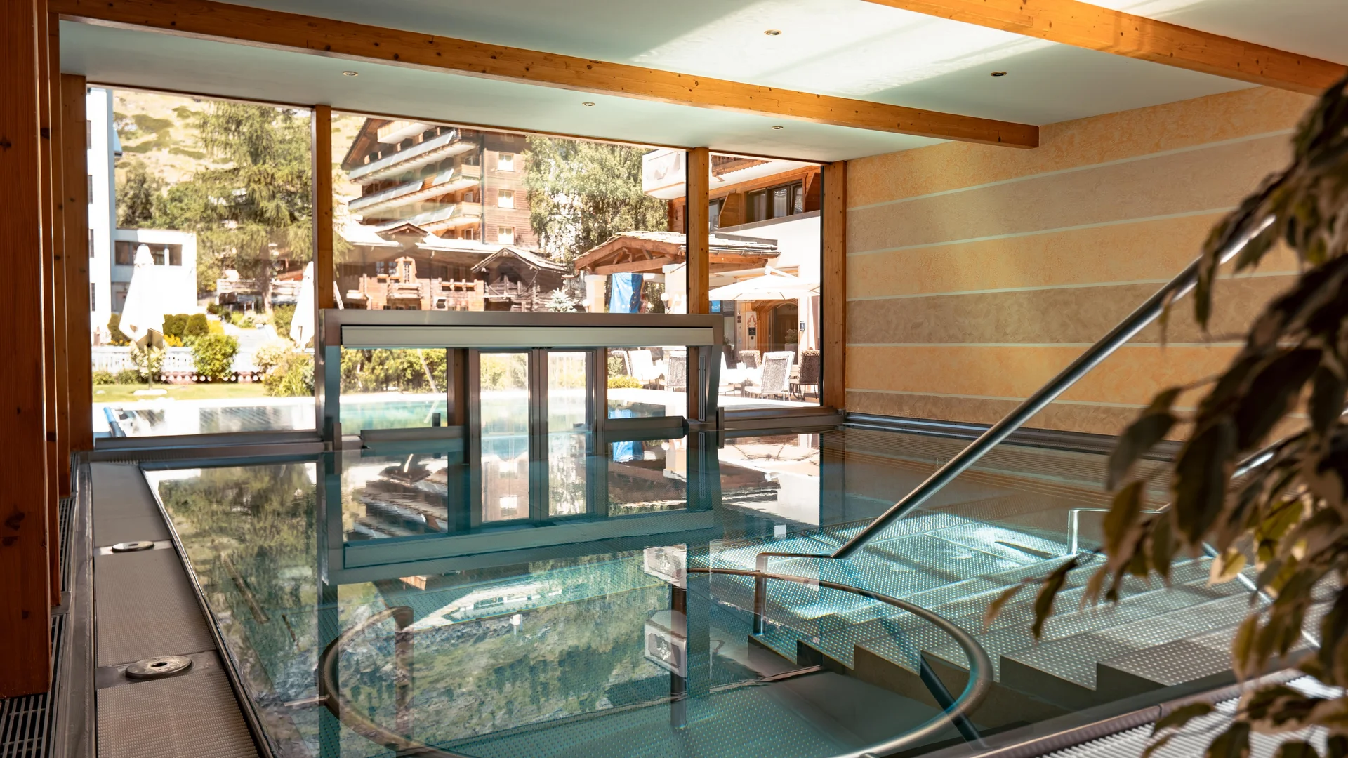 Indoor pool with massage jets and sunlight.
